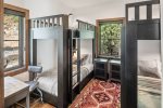 Third bedroom offers 4 twins in two bunk beds with reading light and charging arera.